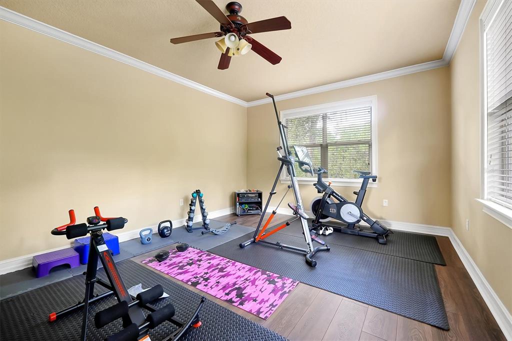 12012 Rambling Oak Boulevard Orlando, FL 32832 - Photo 32 of 49 a view of a room with gym equipment
