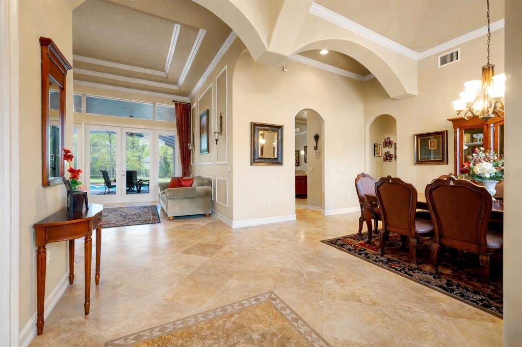 12012 Rambling Oak Boulevard Orlando, FL 32832 - Photo 9 of 49 a living room with furniture and a dining table