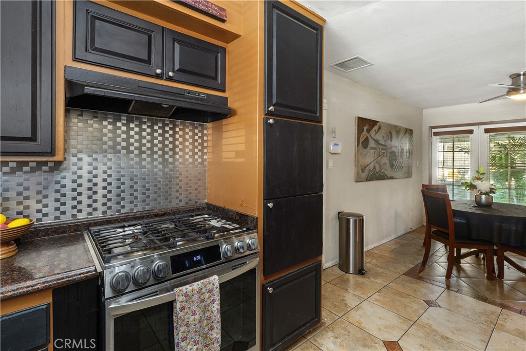 10040 Hedrick Avenue Riverside, CA 92503 - Photo 15 of 33 a kitchen with a stove and a microwave