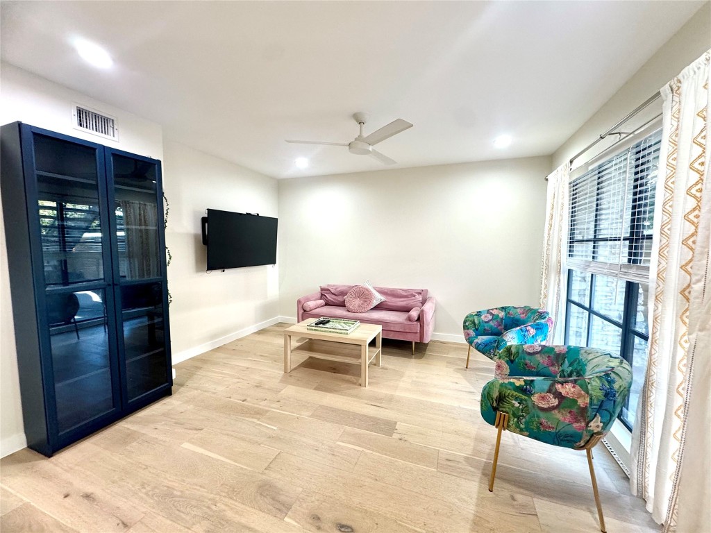 400 East 30th Street, Unit 101 Austin, TX 78705 - Photo 12 of 27 a living room with furniture and a flat screen tv
