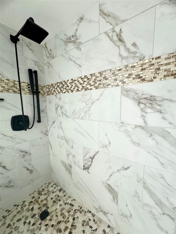 400 East 30th Street, Unit 101 Austin, TX 78705 - Photo 19 of 27 Full bath with a tile shower