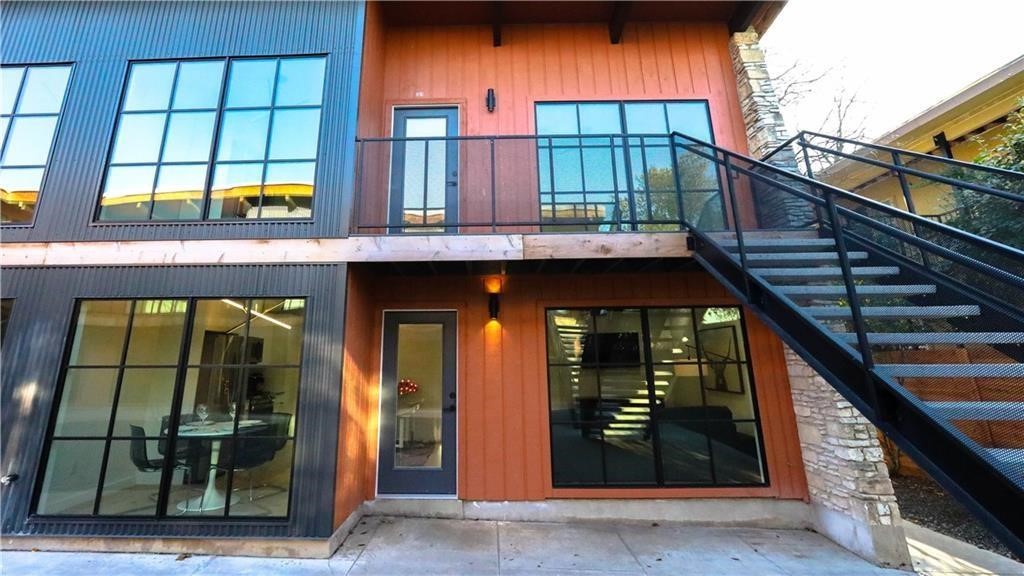 400 East 30th Street, Unit 101 Austin, TX 78705 - Photo 3 of 27 a view of a brick house with a large window