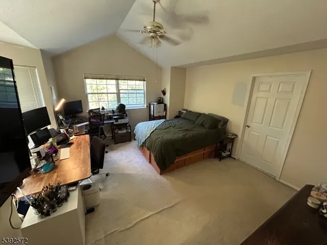 a bedroom with bed and window