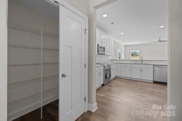 a kitchen with appliances cabinets and a sink