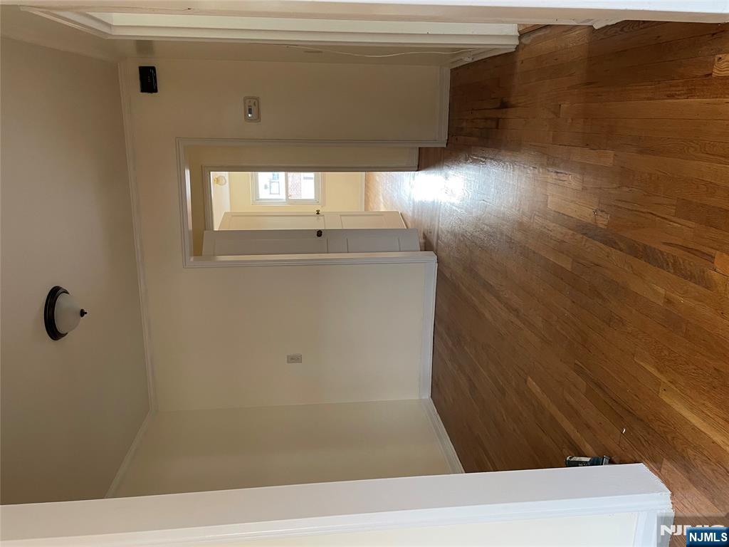 138 Midland Place, Unit 2 Newark, NJ 07106 - Photo 2 of 6 a view of a hallway with wooden floor