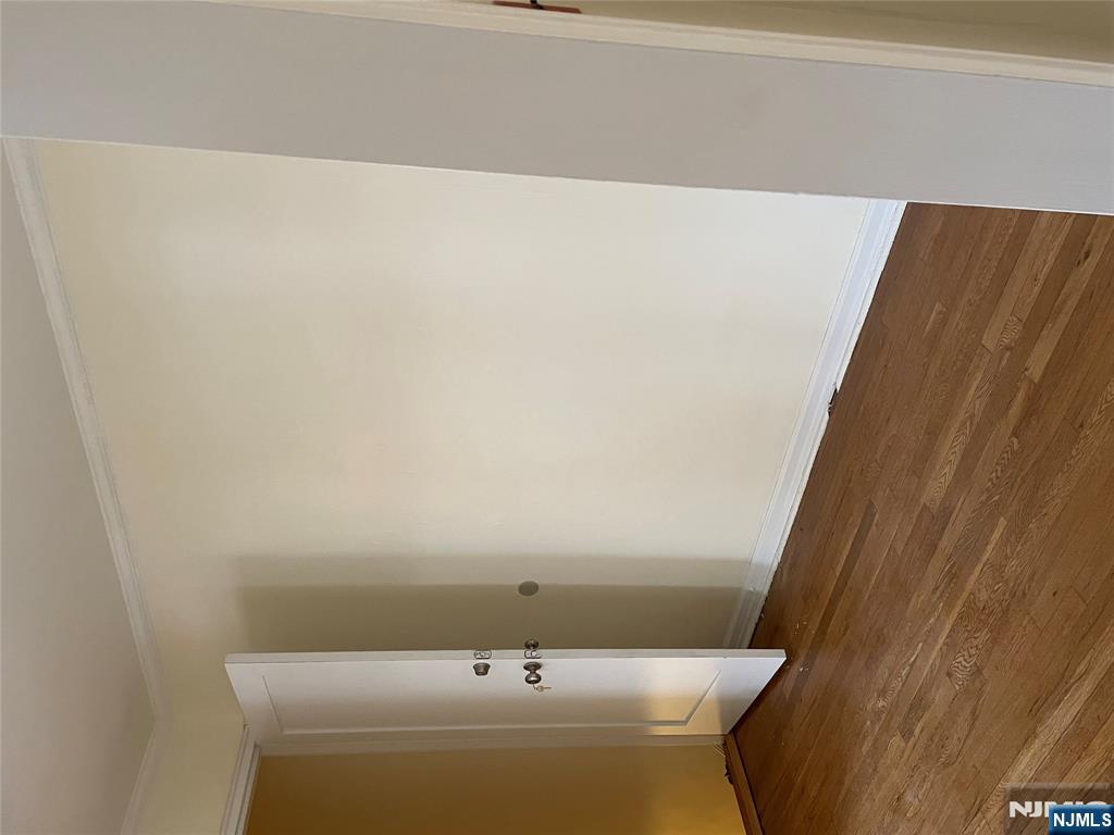 138 Midland Place, Unit 2 Newark, NJ 07106 - Photo 4 of 6 a view of an empty room with wooden floor