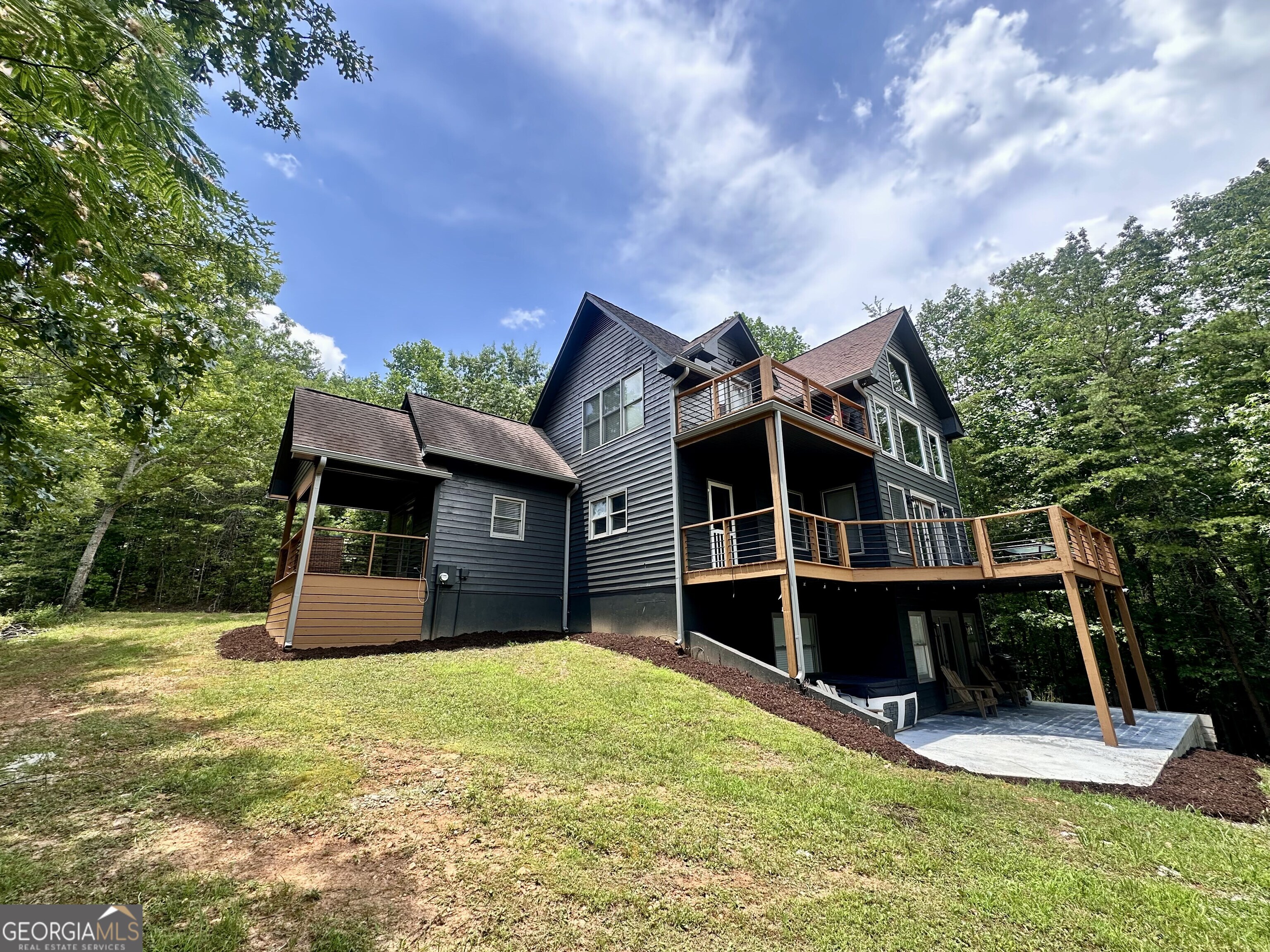 2769 Bean Creek Road Sautee Nacoochee, GA 30571 - Photo 2 of 33 a front view of a house with a yard