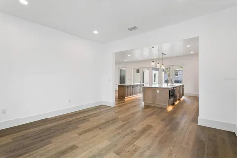 a close view of a sink and cabinets in a kitchen