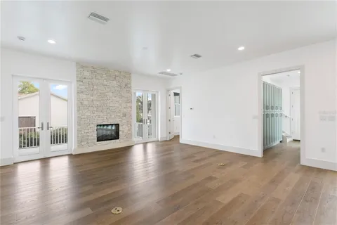 a view of an house with backyard space and windows
