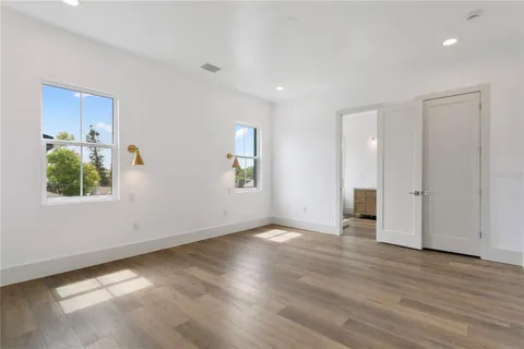 a view of cabinets with wooden floor