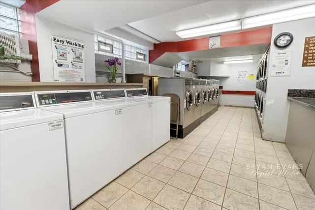 a kitchen with stainless steel appliances a sink and a cabinets
