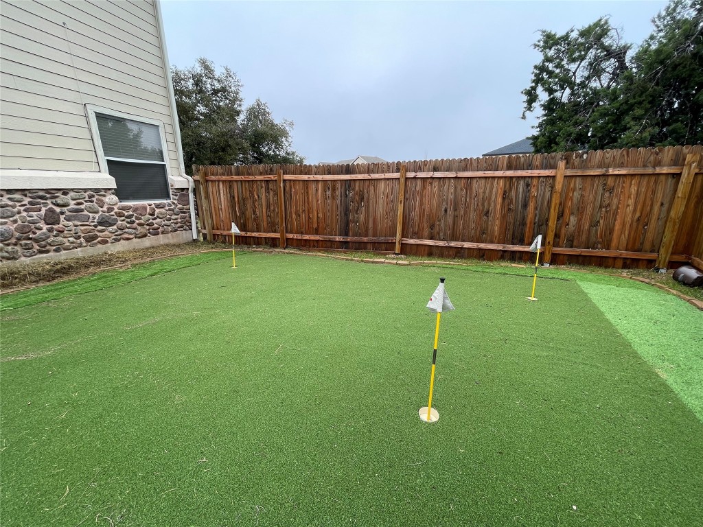 404 Buckhorn Drive Point Venture, TX 78645 - Photo 1 of 1 a backyard of a house with lots of green space