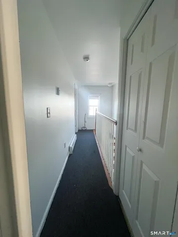 a view of a hallway with windows