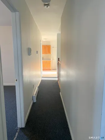 a view of hallway with stairs