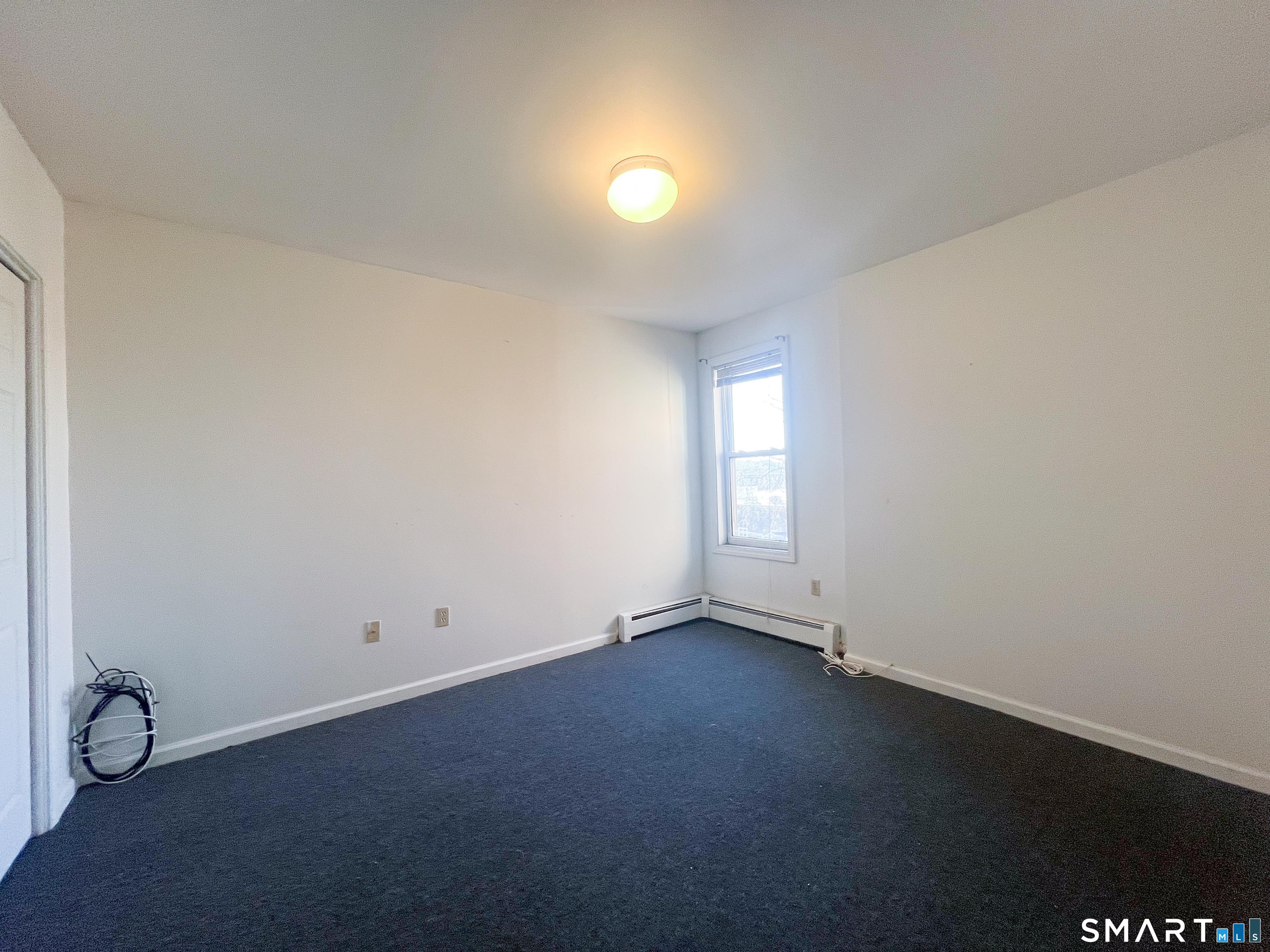 99 William Street, Unit B Bridgeport, CT 06608 - Photo 3 of 16 an empty room with a window