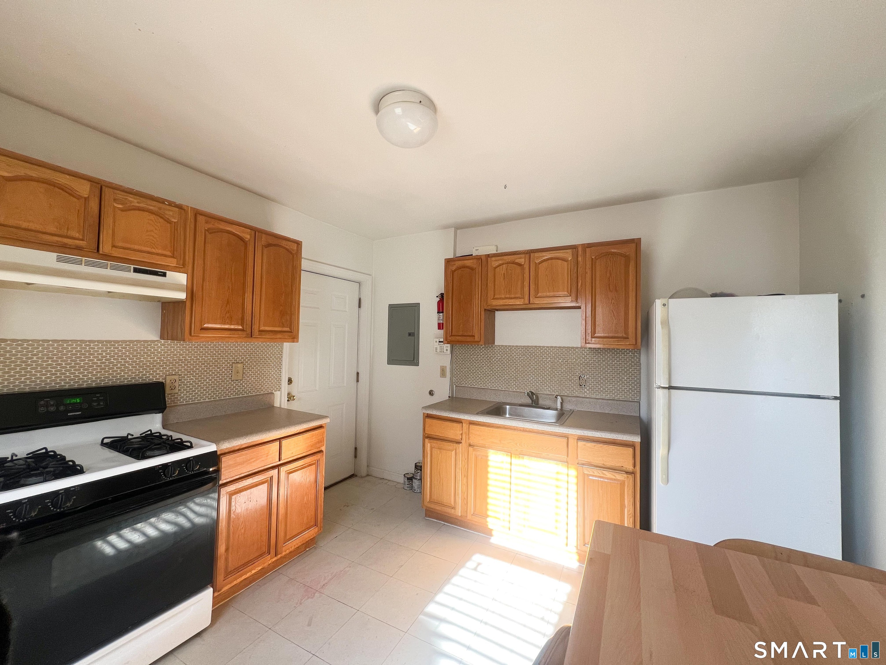 99 William Street, Unit B Bridgeport, CT 06608 - Photo 10 of 16 a kitchen with a sink appliances and cabinets