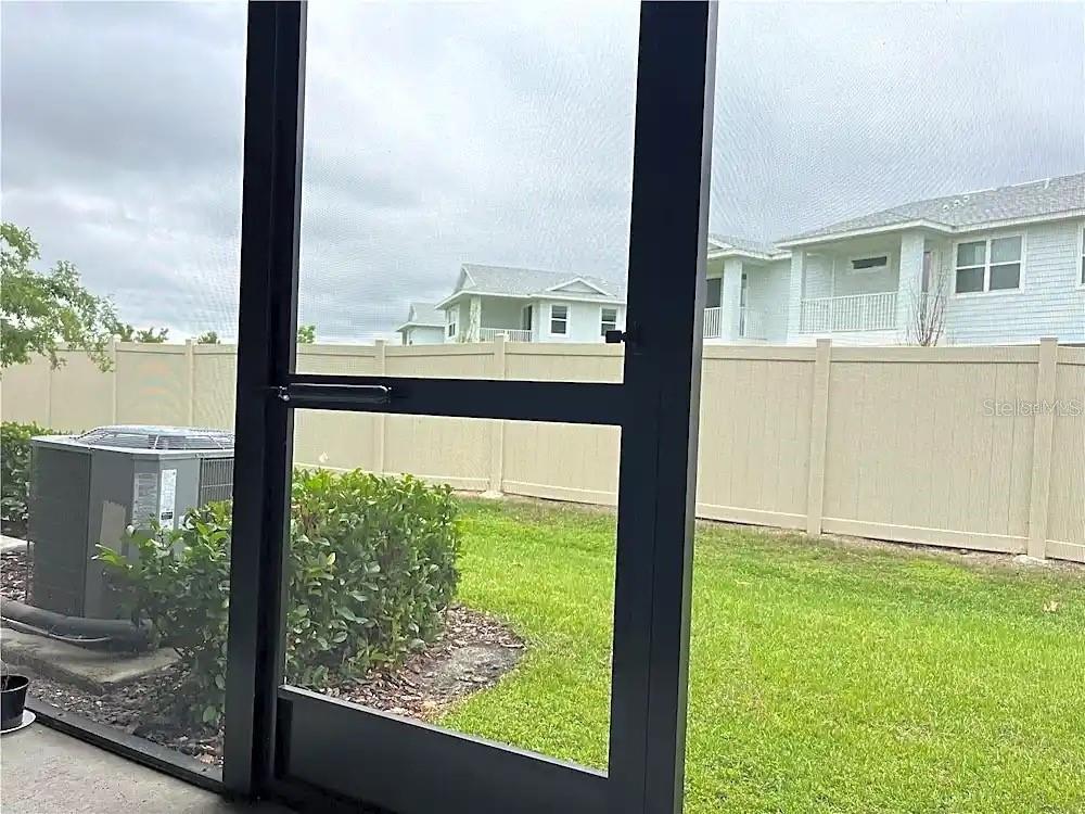 31751 Blue Passing Loop Wesley Chapel, FL 33545 - Photo 17 of 18 a view of a garden from a window