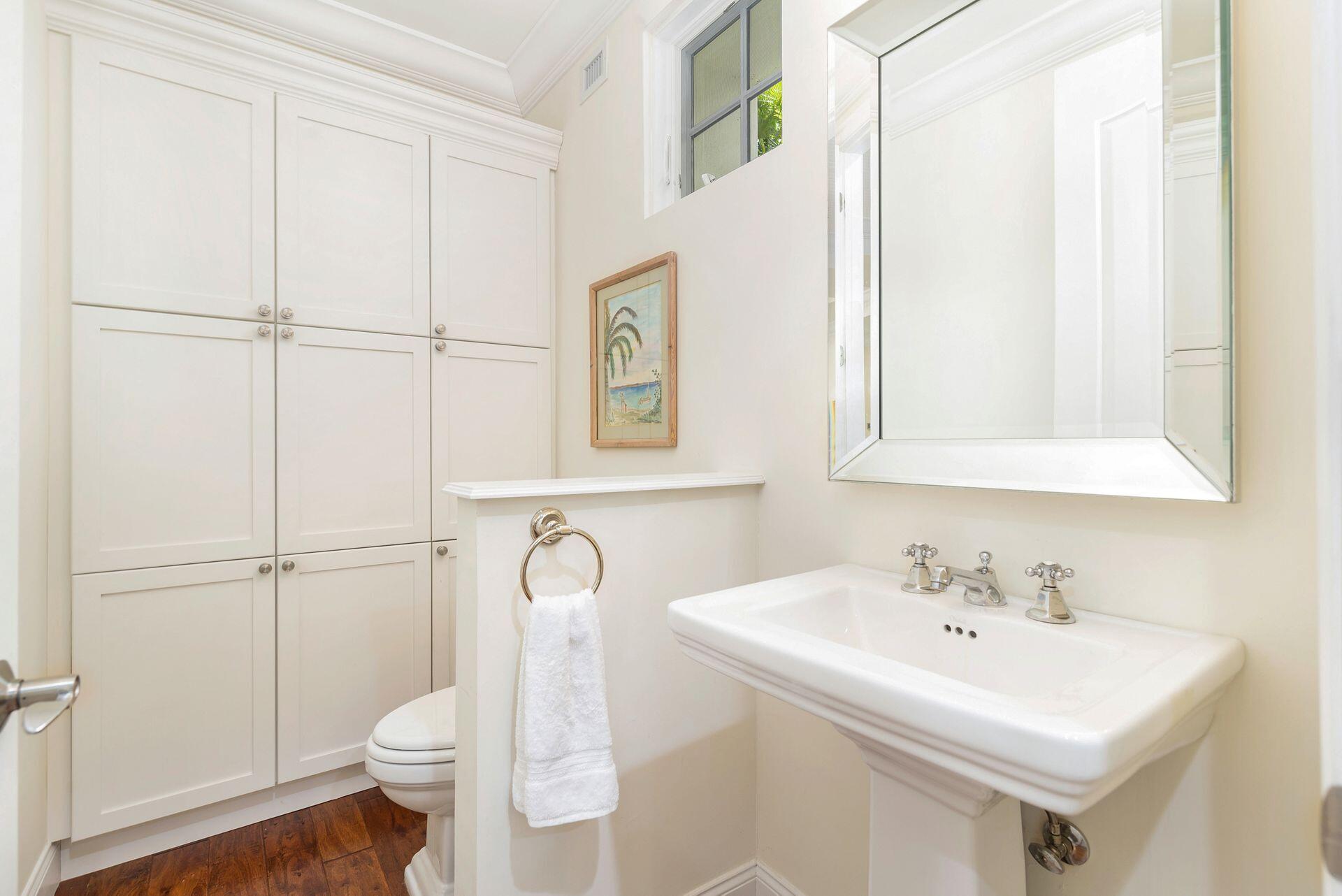 135 Root Trail, Unit A Palm Beach, FL 33480 - Photo 16 of 25 a bathroom with a sink a toilet and shower