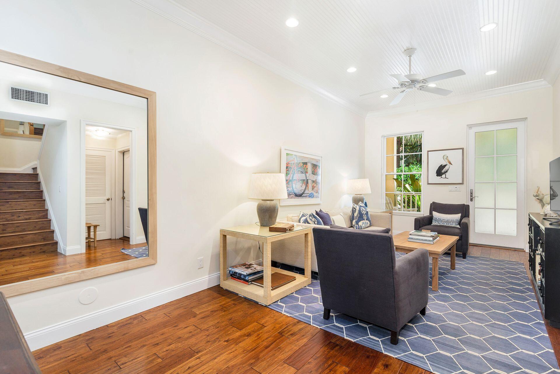 135 Root Trail, Unit A Palm Beach, FL 33480 - Photo 8 of 25 a living room with furniture and a wooden floor