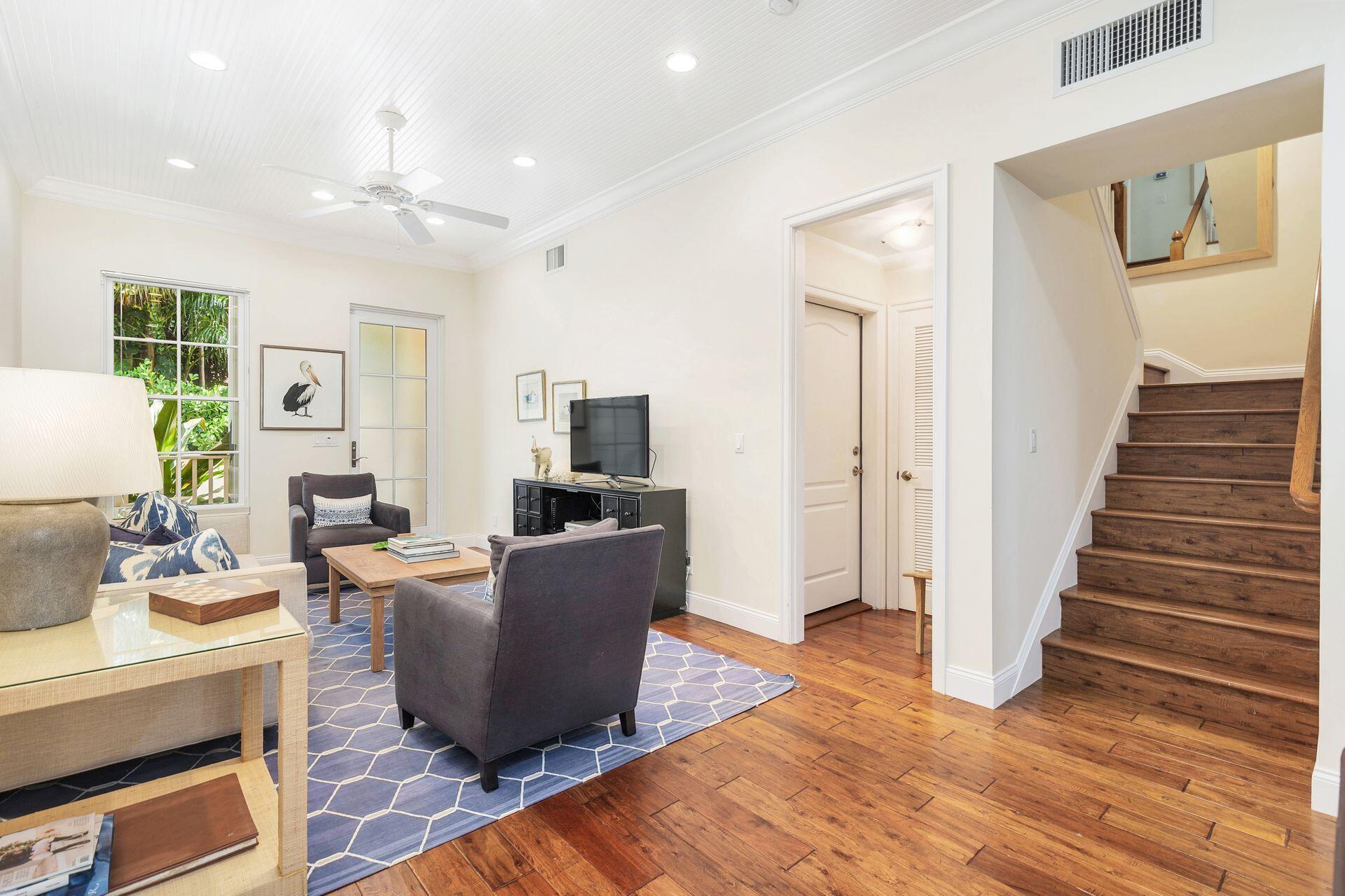 135 Root Trail, Unit A Palm Beach, FL 33480 - Photo 9 of 25 a living room with furniture and a wooden floor