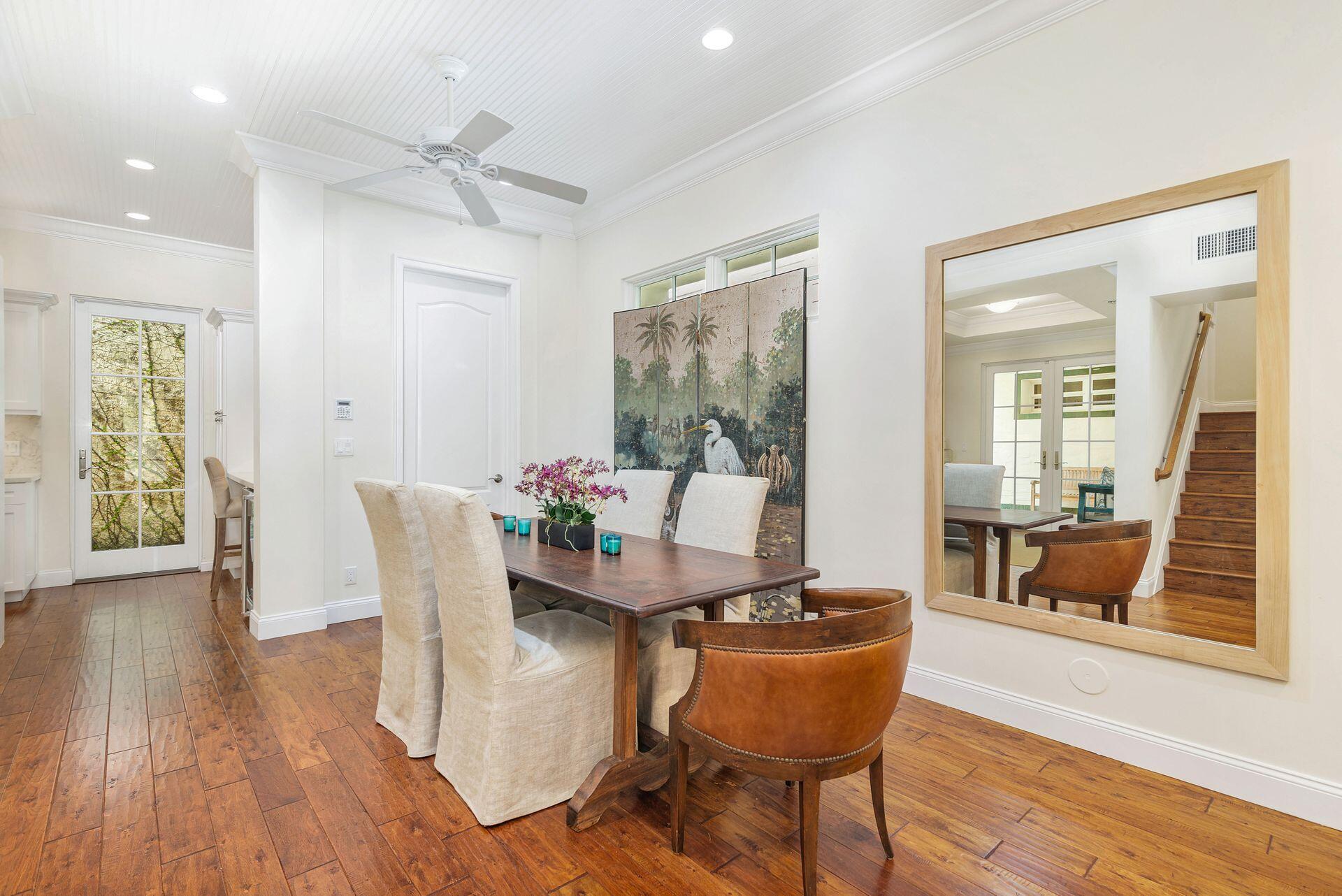 135 Root Trail, Unit A Palm Beach, FL 33480 - Photo 10 of 25 a dining room with furniture and wooden floor