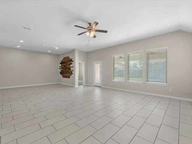 a view of an empty room with a window