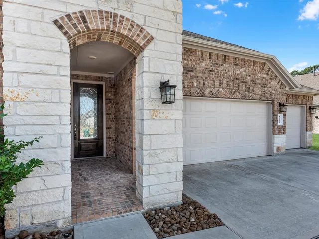 a view of a wooden door of the house