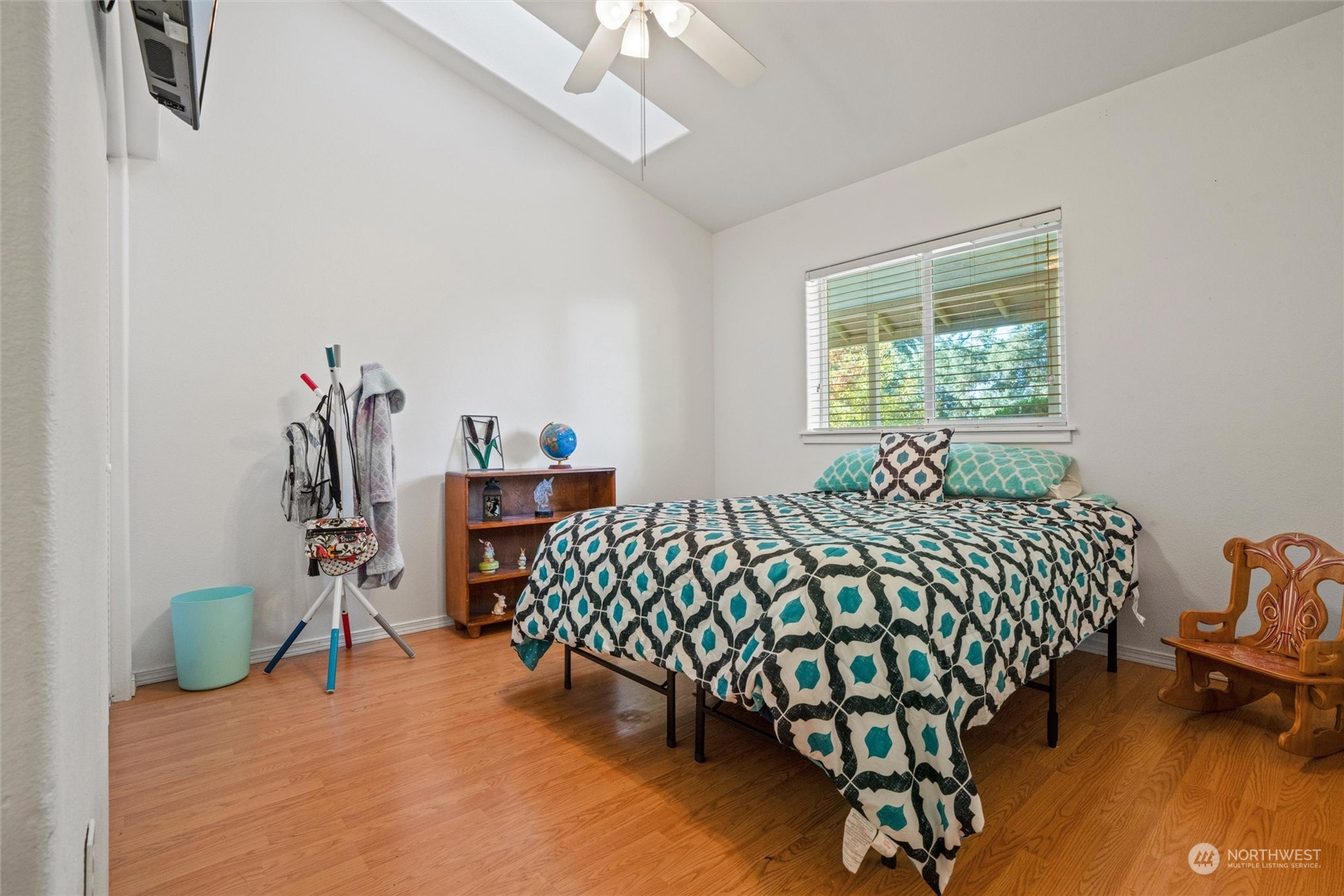 17232 Kaylen Lane Southwest Rochester, WA 98579 - Photo 23 of 40 a bedroom with bed and a chandelier