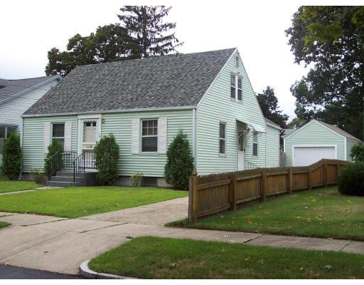 134 Winton Street Springfield, MA 01118 - Photo 1 of 12 a front view of a house with a yard