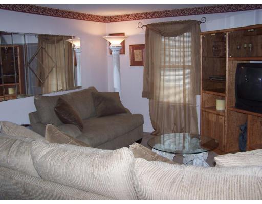 134 Winton Street Springfield, MA 01118 - Photo 6 of 12 a living room with furniture and a flat screen tv