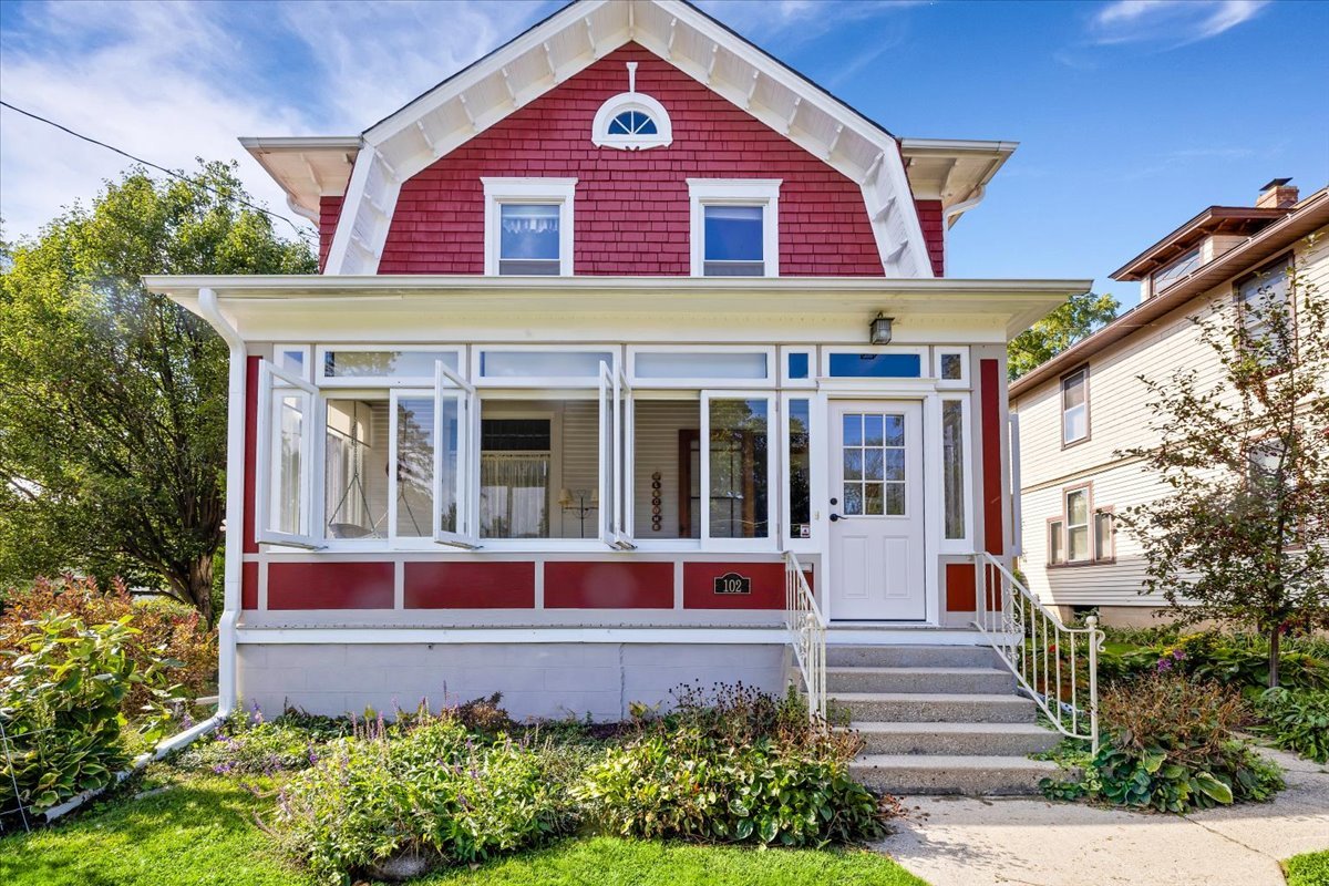 102 Monroe Street Elgin, IL 60123 - Photo 1 of 34 a front view of a house with a yard