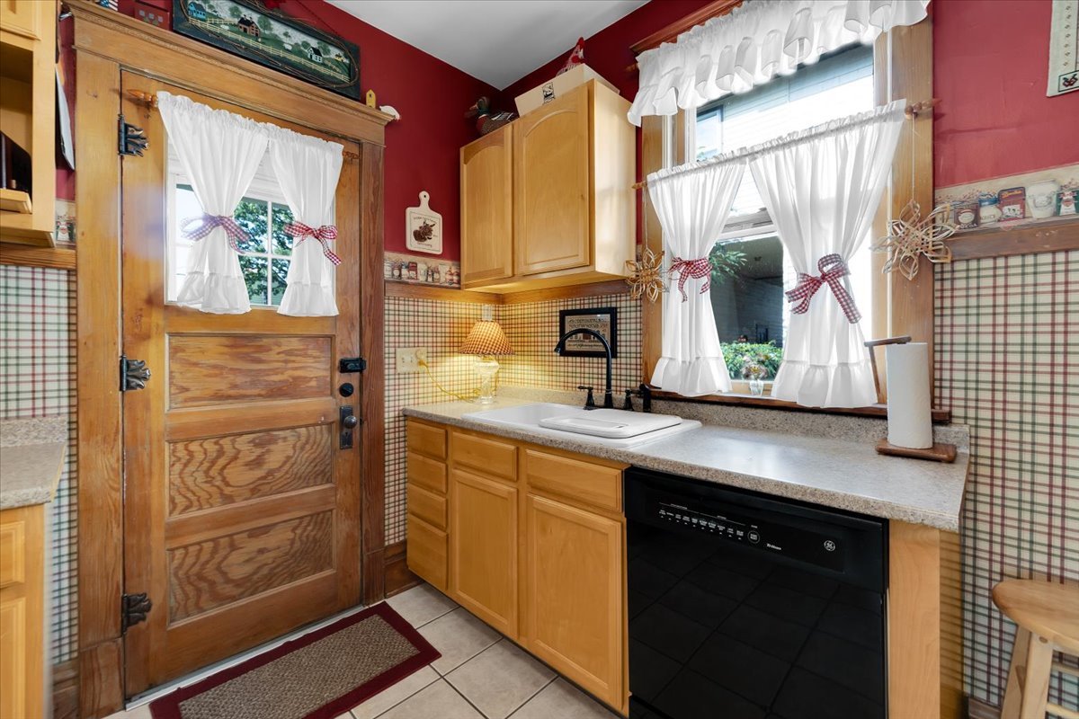 102 Monroe Street Elgin, IL 60123 - Photo 14 of 34 a bathroom with a sink and a mirror