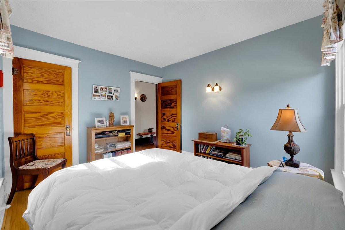 102 Monroe Street Elgin, IL 60123 - Photo 23 of 34 a bedroom with a bed and dresser in it