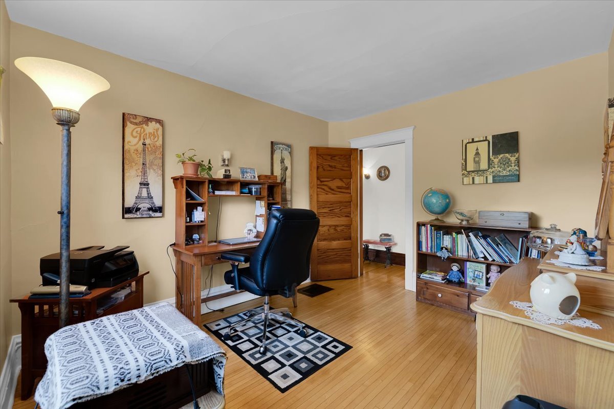 102 Monroe Street Elgin, IL 60123 - Photo 24 of 34 a living room with furniture and a wooden floor