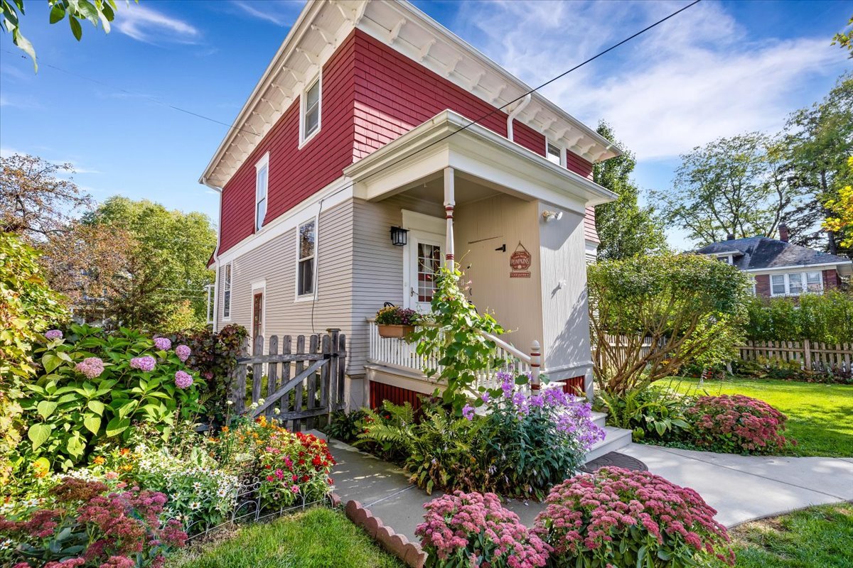 102 Monroe Street Elgin, IL 60123 - Photo 26 of 34 a front view of a house with a yard