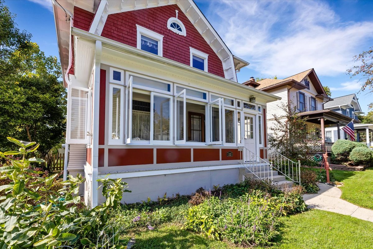 102 Monroe Street Elgin, IL 60123 - Photo 3 of 34 a front view of a house with garden