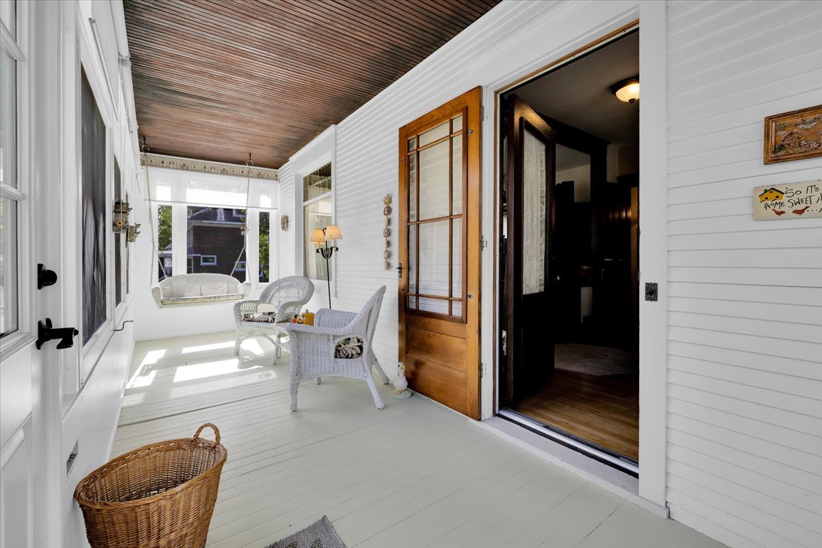 102 Monroe Street Elgin, IL 60123 - Photo 5 of 34 a living room with furniture a window and a glass door