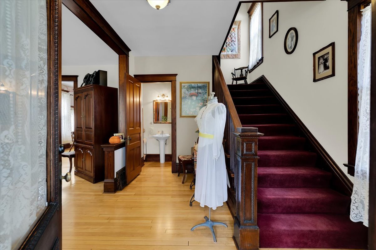 102 Monroe Street Elgin, IL 60123 - Photo 6 of 34 a view of entryway and hall with wooden floor