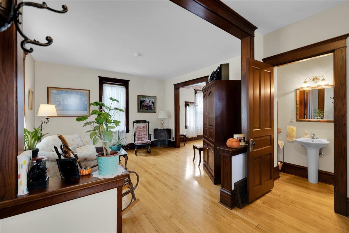 102 Monroe Street Elgin, IL 60123 - Photo 8 of 34 a living room with furniture and wooden floor