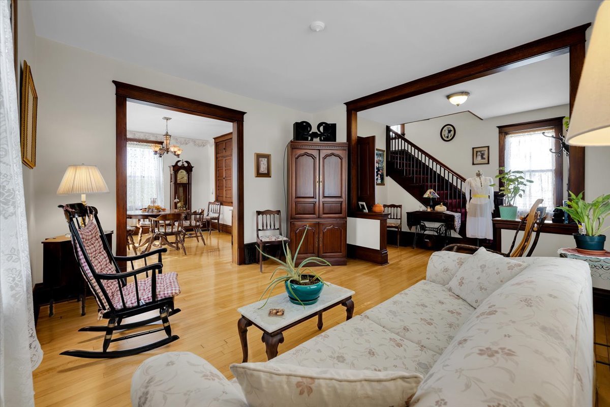 102 Monroe Street Elgin, IL 60123 - Photo 9 of 34 a living room with furniture and a wooden floor