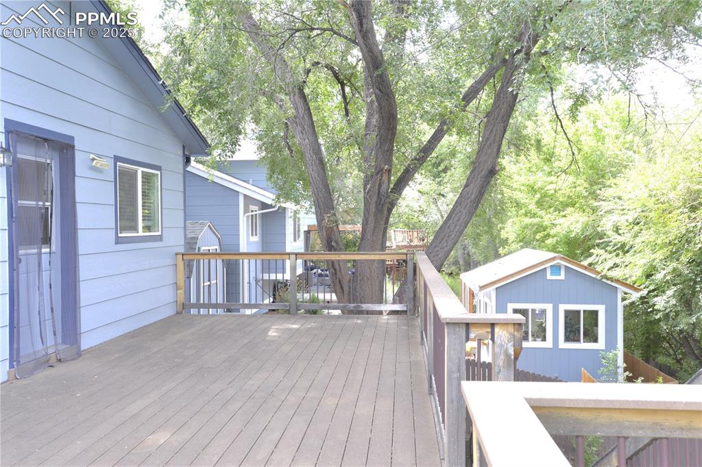 575 Blossom Field Road Fountain, CO 80817 - Photo 15 of 24 a front view of a house with a yard and trees