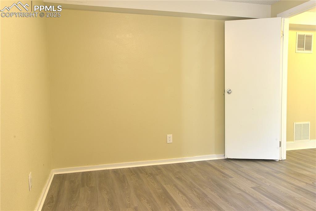 575 Blossom Field Road Fountain, CO 80817 - Photo 22 of 24 a view of a small space with wooden floor