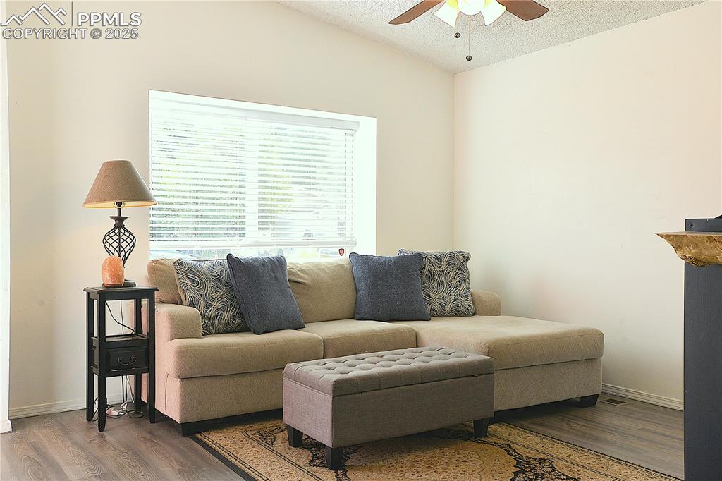 575 Blossom Field Road Fountain, CO 80817 - Photo 4 of 24 a living room with furniture and a window