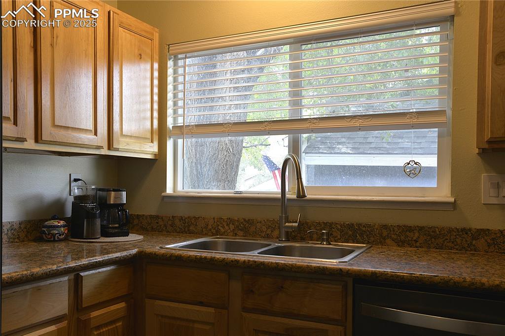 575 Blossom Field Road Fountain, CO 80817 - Photo 8 of 24 a kitchen with a sink and a window