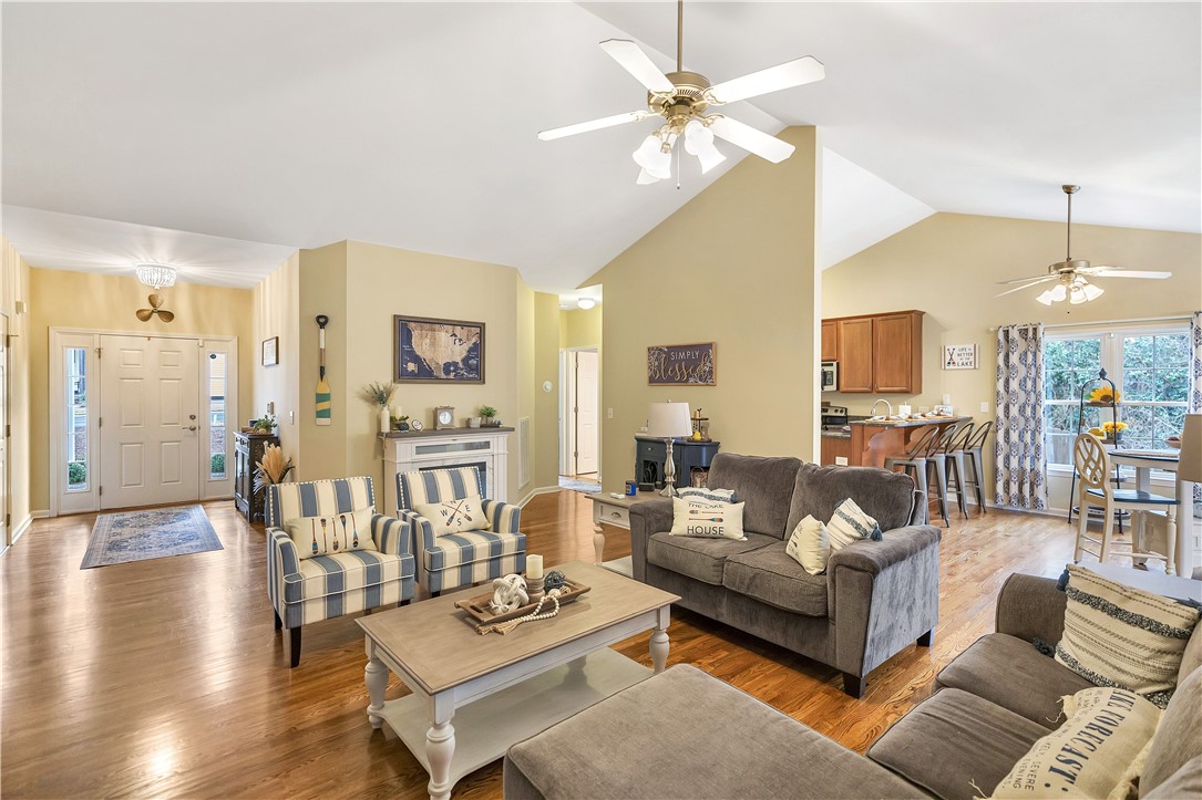101 Riviera Circle Anderson, SC 29621 - Photo 8 of 35 This living area features vaulted ceilings, rich hardwood flooring, and abundant natural light.