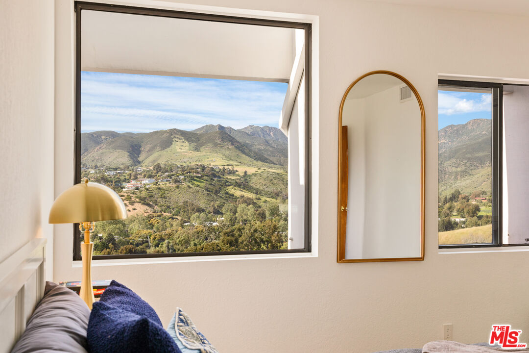 29221 Heathercliff Road, Unit 13 Malibu, CA 90265 - Photo 28 of 43 a view of a living room with a painting on the wall
