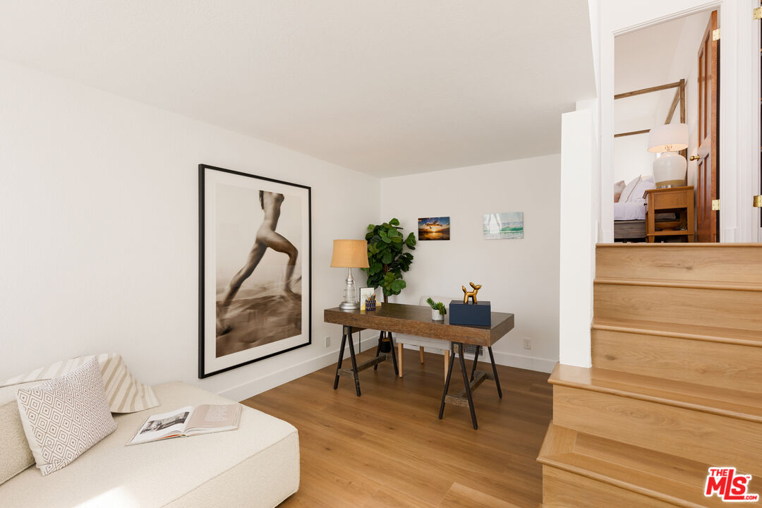 29221 Heathercliff Road, Unit 13 Malibu, CA 90265 - Photo 31 of 43 a living room with furniture and a painting on the wall