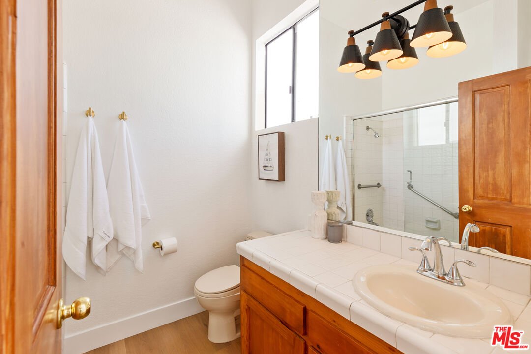 29221 Heathercliff Road, Unit 13 Malibu, CA 90265 - Photo 32 of 43 a bathroom with a sink toilet and shower
