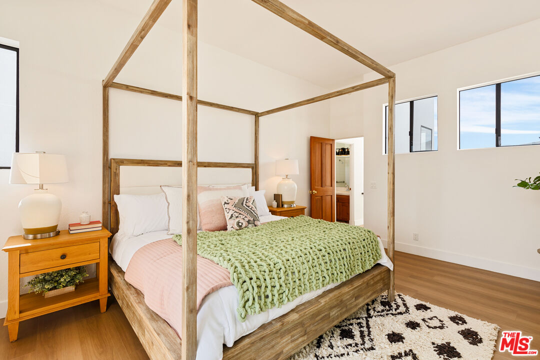 29221 Heathercliff Road, Unit 13 Malibu, CA 90265 - Photo 35 of 43 a bedroom with a bed and a window with the outer view