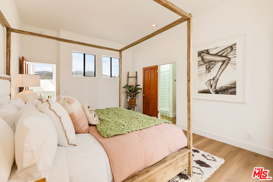 29221 Heathercliff Road, Unit 13 Malibu, CA 90265 - Photo 36 of 43 a bedroom with a bed and a window